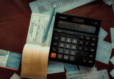 a calculator sitting on top of a wooden table