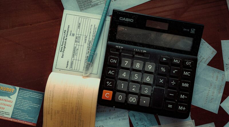 a calculator sitting on top of a wooden table